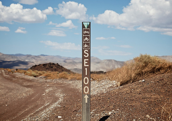 BLM SE100 Marker & Puffy Clouds - Fossil Falls, CA - 2015