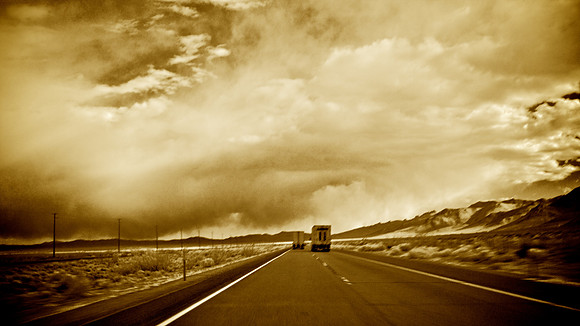 Twin Trucks Heading South Towards Storm - Owens Valley, CA - 2013